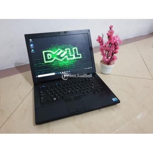 image of a white laptop with a black Dell logo